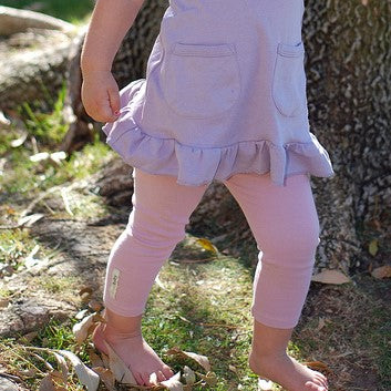 Child wearing Organic Leggings in Mauve.