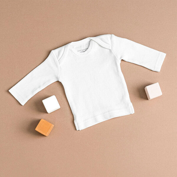 Organic Long-Sleeve Shirt in White on a tan background.