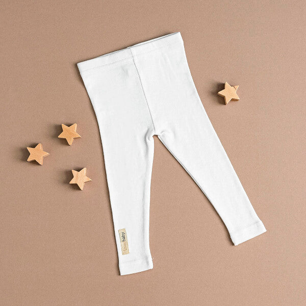 Organic Leggings in White on a tan background.