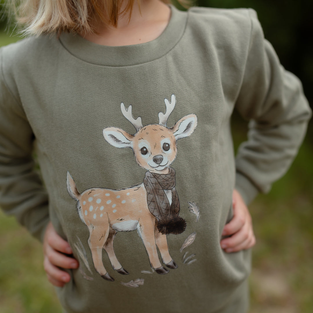 Child wearing an outfit from the Little Wilds collection