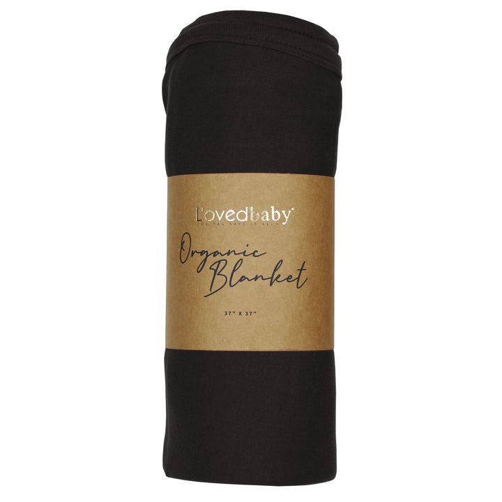 image of rolled black blanket in Kraft paper packaging