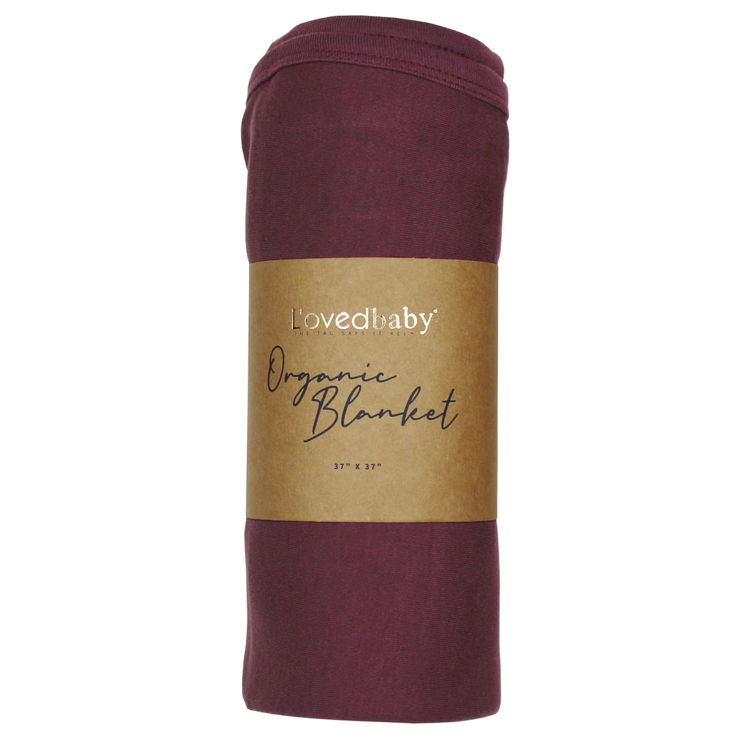 image of rolled plum blanket in Kraft paper packaging