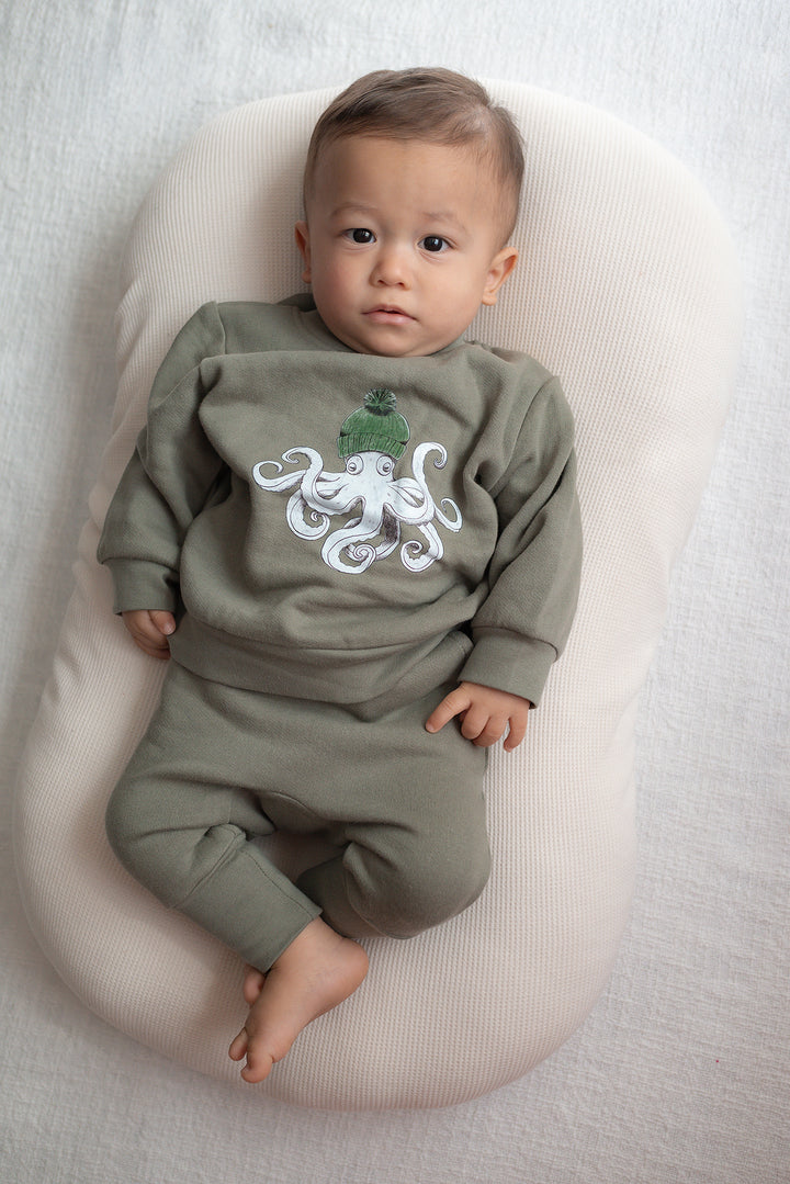 Child wearing Kids' Cozy Fleece Crewneck Sweatshirt in Octopus.