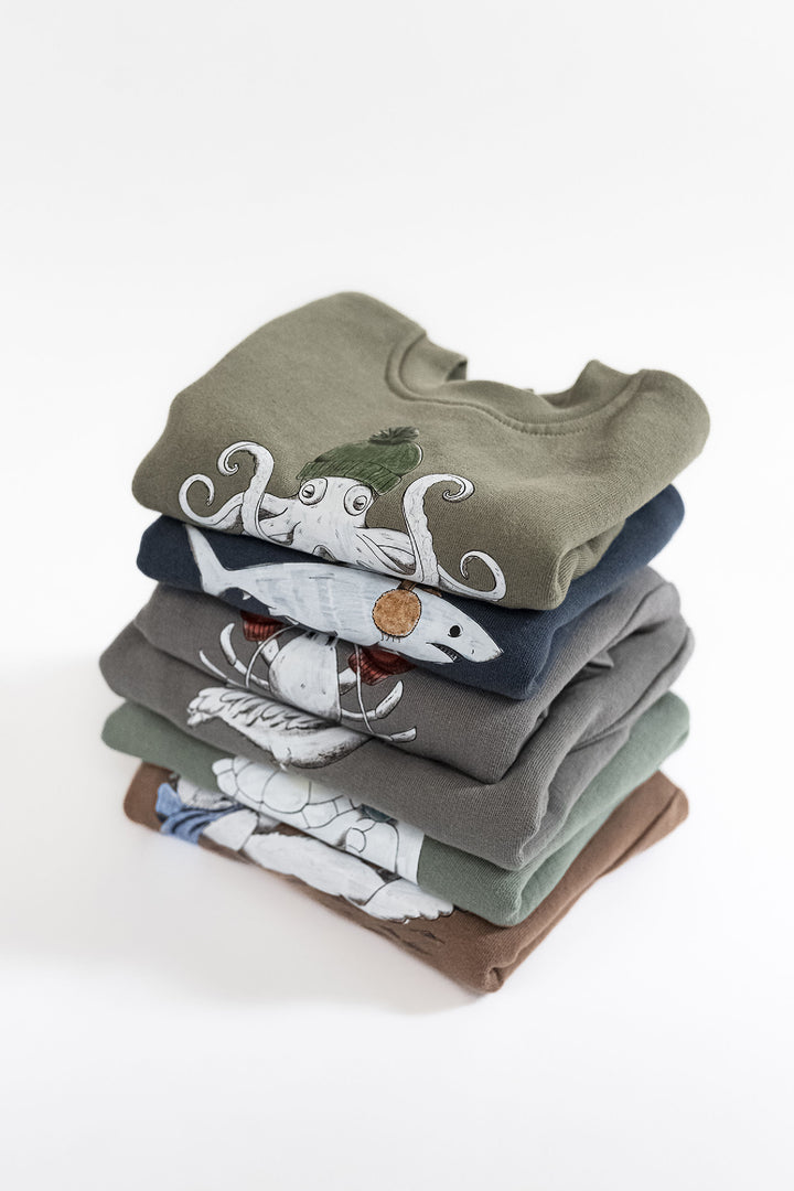 Child wearing Cozy Fleece Crewneck Sweatshirt in Octopus.