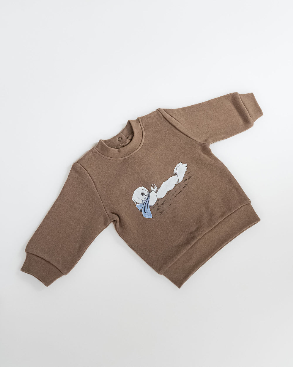 Child wearing Cozy Fleece Crewneck Sweatshirt in Sea Otter.