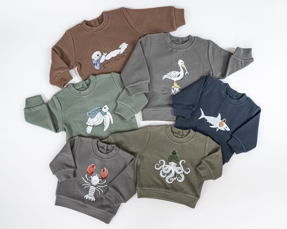 Child wearing Cozy Fleece Crewneck Sweatshirt in Sea Turtles.