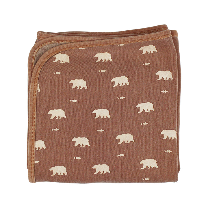 Brown blanket with white bear pattern on a white background