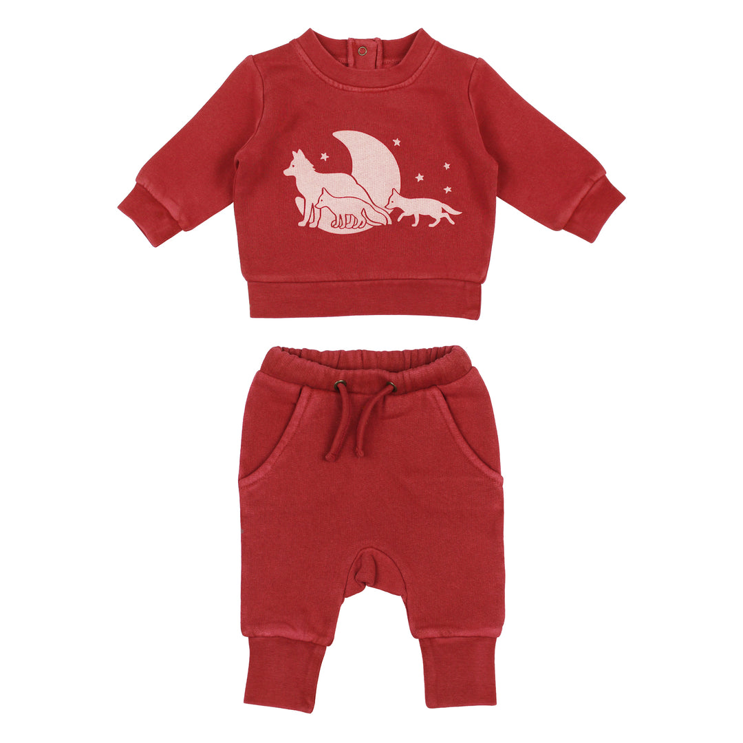 Red children's sweatshirt and pants set with a fox design on a white background
