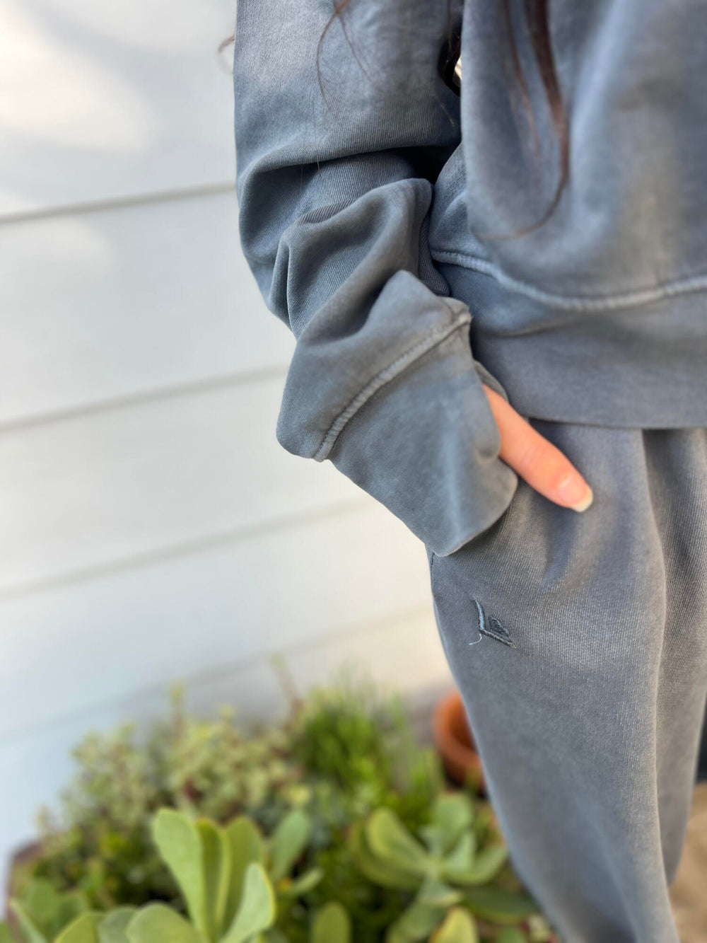 Woman wearing a moonstone sweatshirt