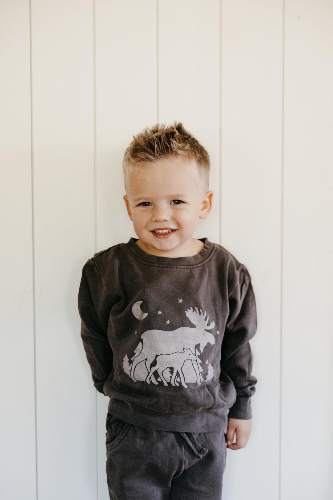 Child wearing Kids' Organic Cozy Graphic Sweatshirt & Jogger Set in Bark Moose 