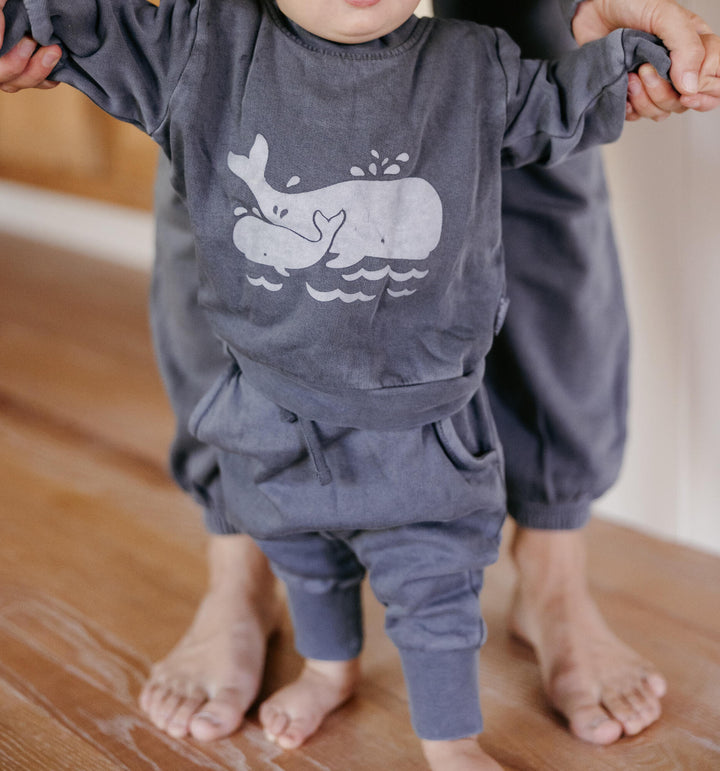 Child wearing Organic Cozy Graphic Sweatshirt & Jogger Set in Moonstone Whale.