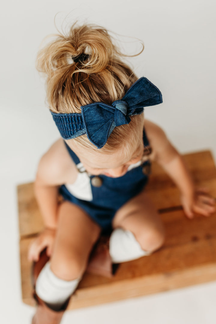 Child wearing Denim Smocked Headband in Denim.
