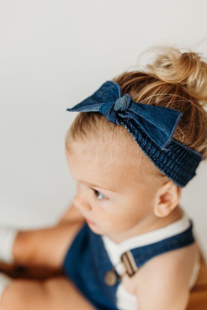 Child wearing Denim Smocked Headband in Denim.