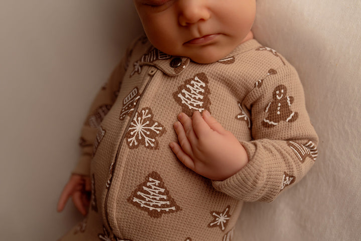 Child wearing Holiday Thermal 2-Way Zipper Footie & Cap Set in Ginger Glow.
