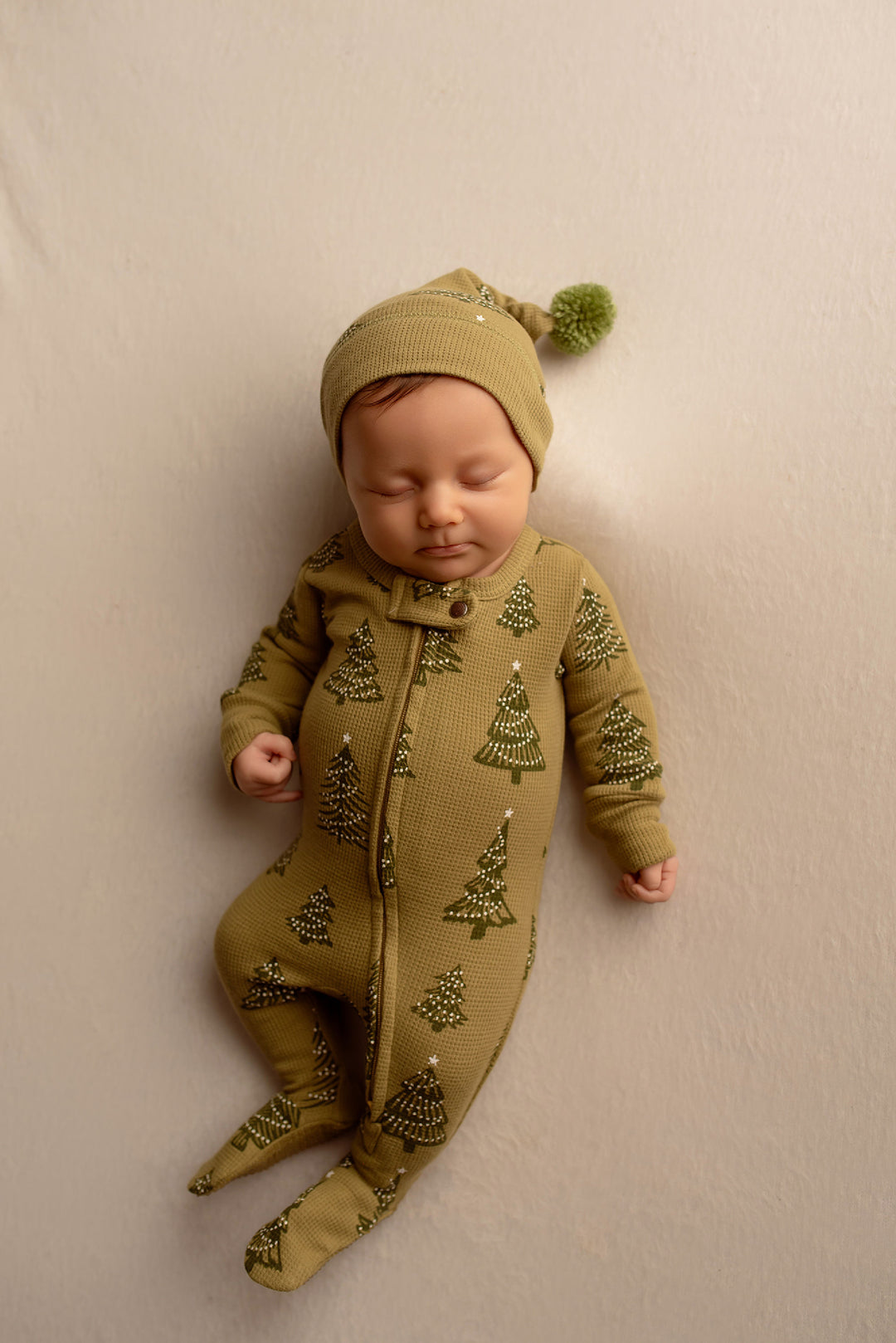 Child wearing Holiday Thermal 2-Way Zipper Footie & Cap Set in Twinkle Tree.
