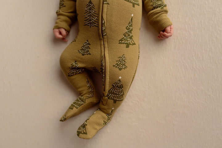 Child wearing Holiday Thermal 2-Way Zipper Footie & Cap Set in Twinkle Tree.