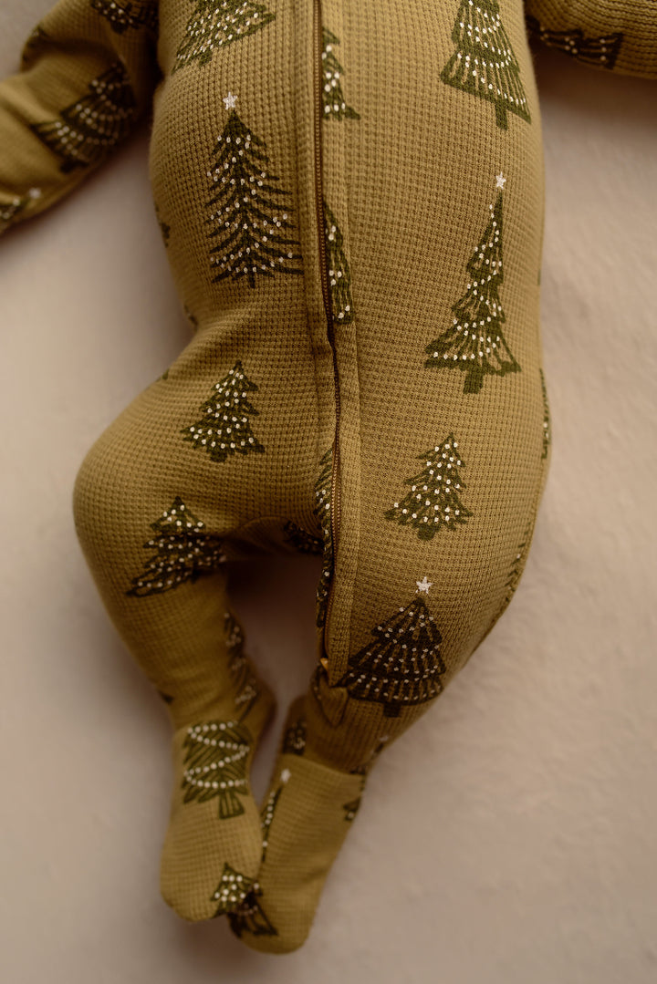 Child wearing Holiday Thermal 2-Way Zipper Footie & Cap Set in Twinkle Tree.