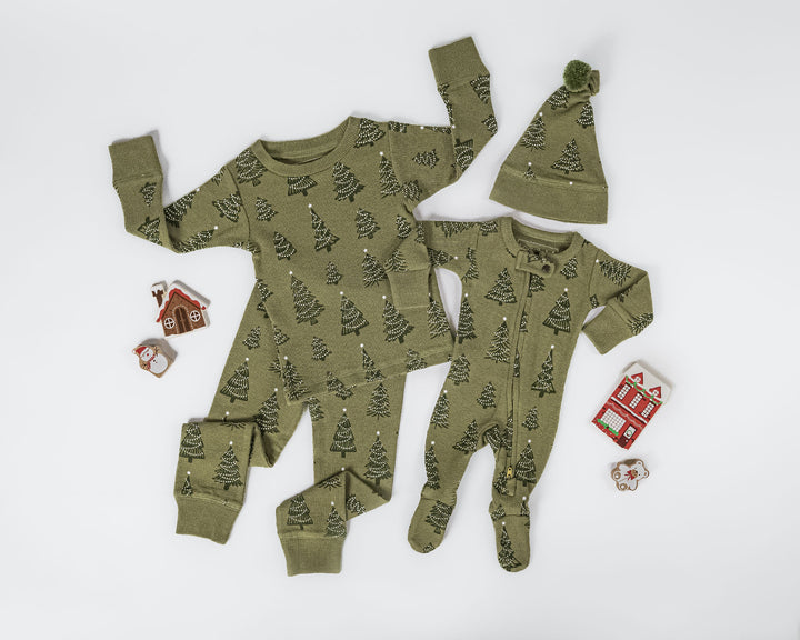 Child wearing Holiday Thermal 2-Way Zipper Footie & Cap Set in Twinkle Tree.