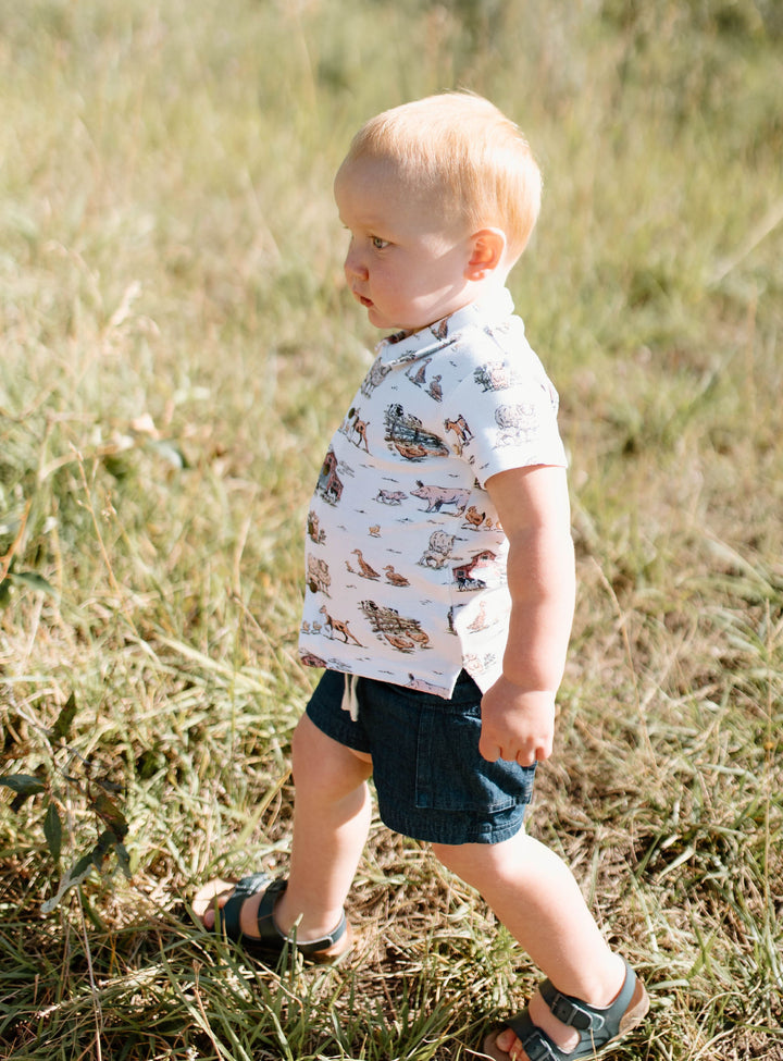 Child wearing Kids' Denim Cargo Short in Denim.
