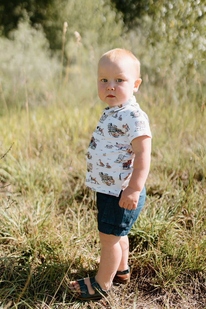 Child wearing Kids' Denim Cargo Short in Denim.