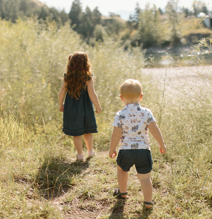 Child wearing Kids' Denim Cargo Short in Denim.