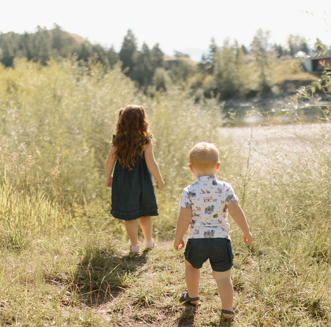 Child wearing Kids' Denim Summer Dress in Denim.