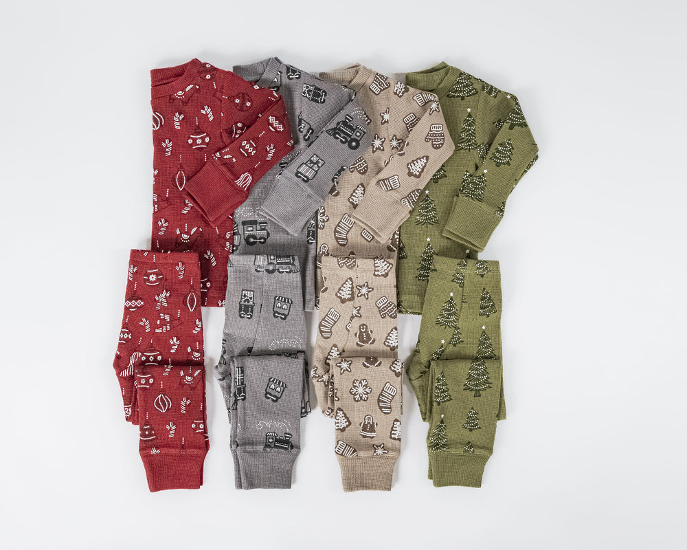 Child wearing Holiday Thermal Long-Sleeve PJ & Cap Set in Tinsel Train.