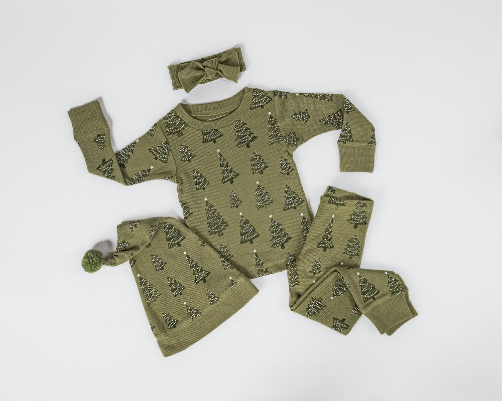 Child wearing Holiday Thermal Long-Sleeve PJ & Cap Set in Twinkle Tree.
