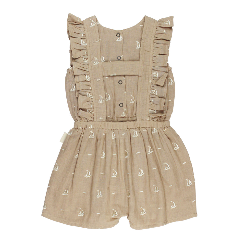 Back view of Kids' Organic Muslin Ruffle Jumper in Oatmeal Sailboat.