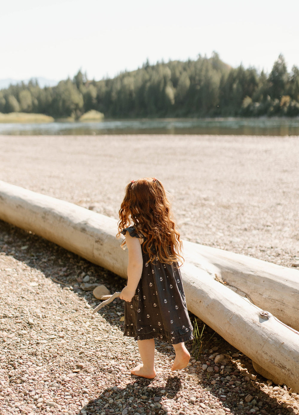 Child wearing Kids' Organic Muslin Summer Dress in Chia Anchor.
