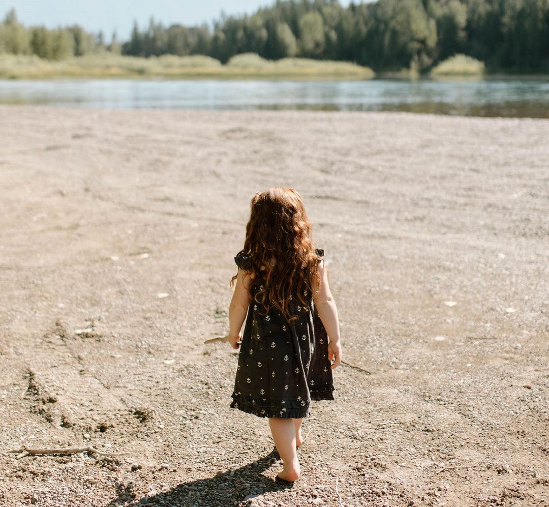 Child wearing Kids' Organic Muslin Summer Dress in Chia Anchor.