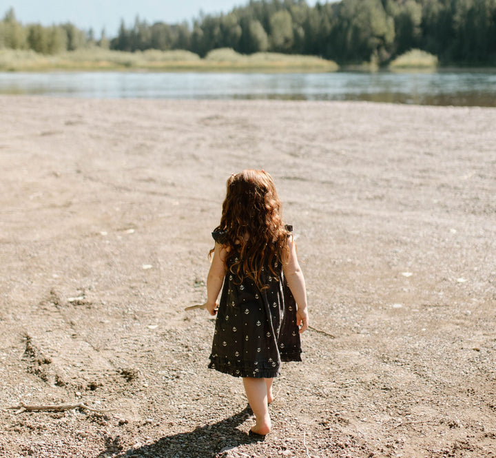 Child wearing Kids' Organic Muslin Summer Dress in Chia Anchor.