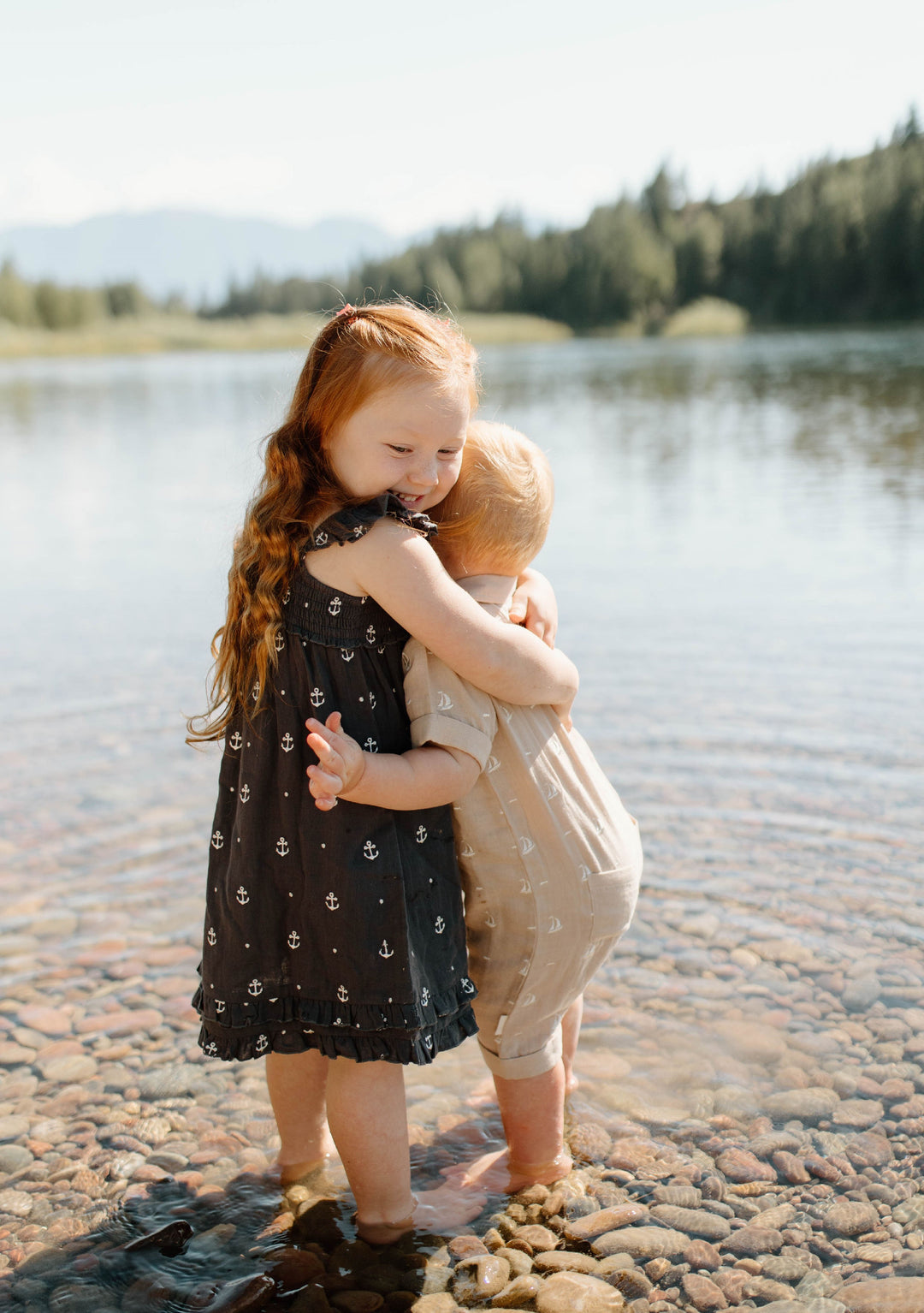 Child wearing Kids' Organic Muslin Summer Dress in Chia Anchor.