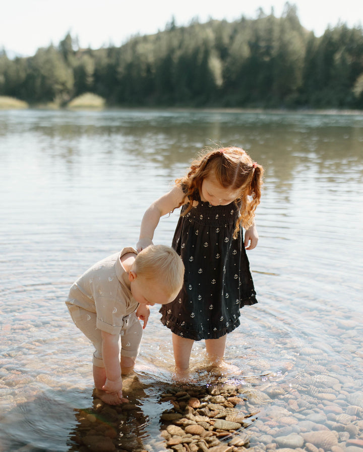 Child wearing Kids' Organic Muslin Summer Dress in Chia Anchor.