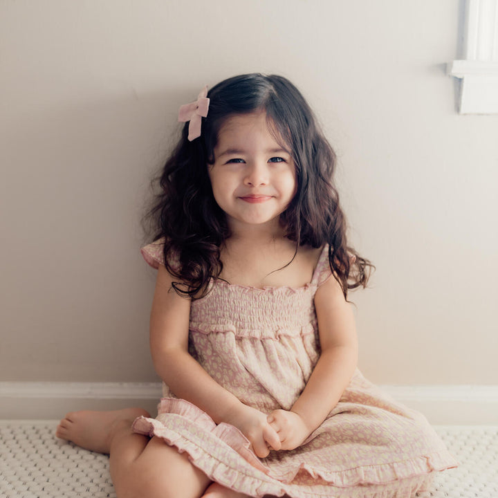 Child wearing Printed Muslin Summer Dress in Carnation Floral.