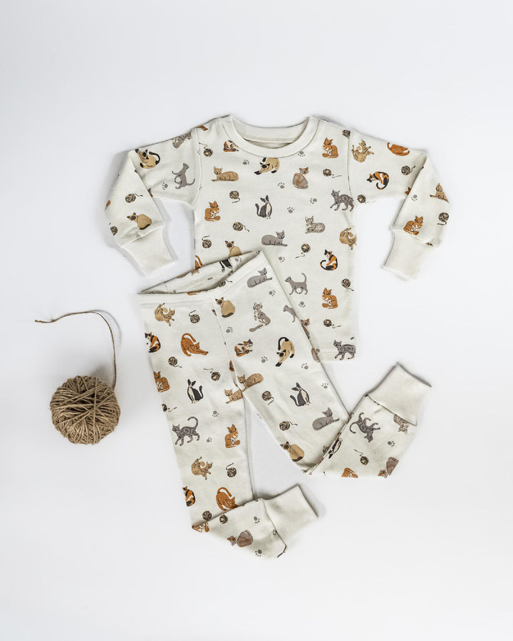 Child wearing Kids' Organic L/Sleeve PJ Set in 9 Lives.