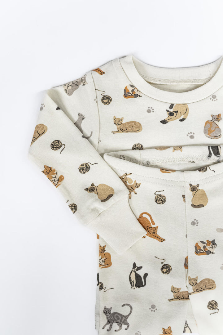 Child wearing Kids' Organic L/Sleeve PJ Set in 9 Lives.