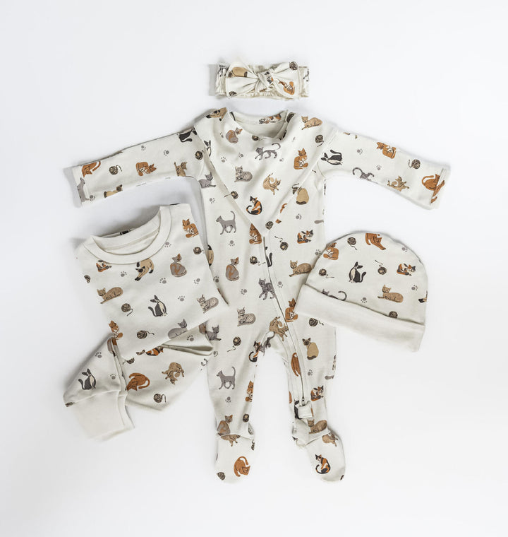 Child wearing Kids' Organic L/Sleeve PJ Set in 9 Lives.