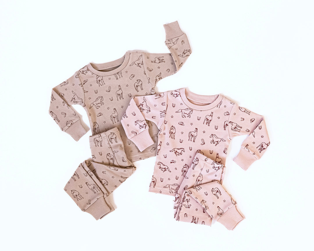 Child wearing Kids' Organic L/Sleeve PJ Set in Mini Buckaroo.