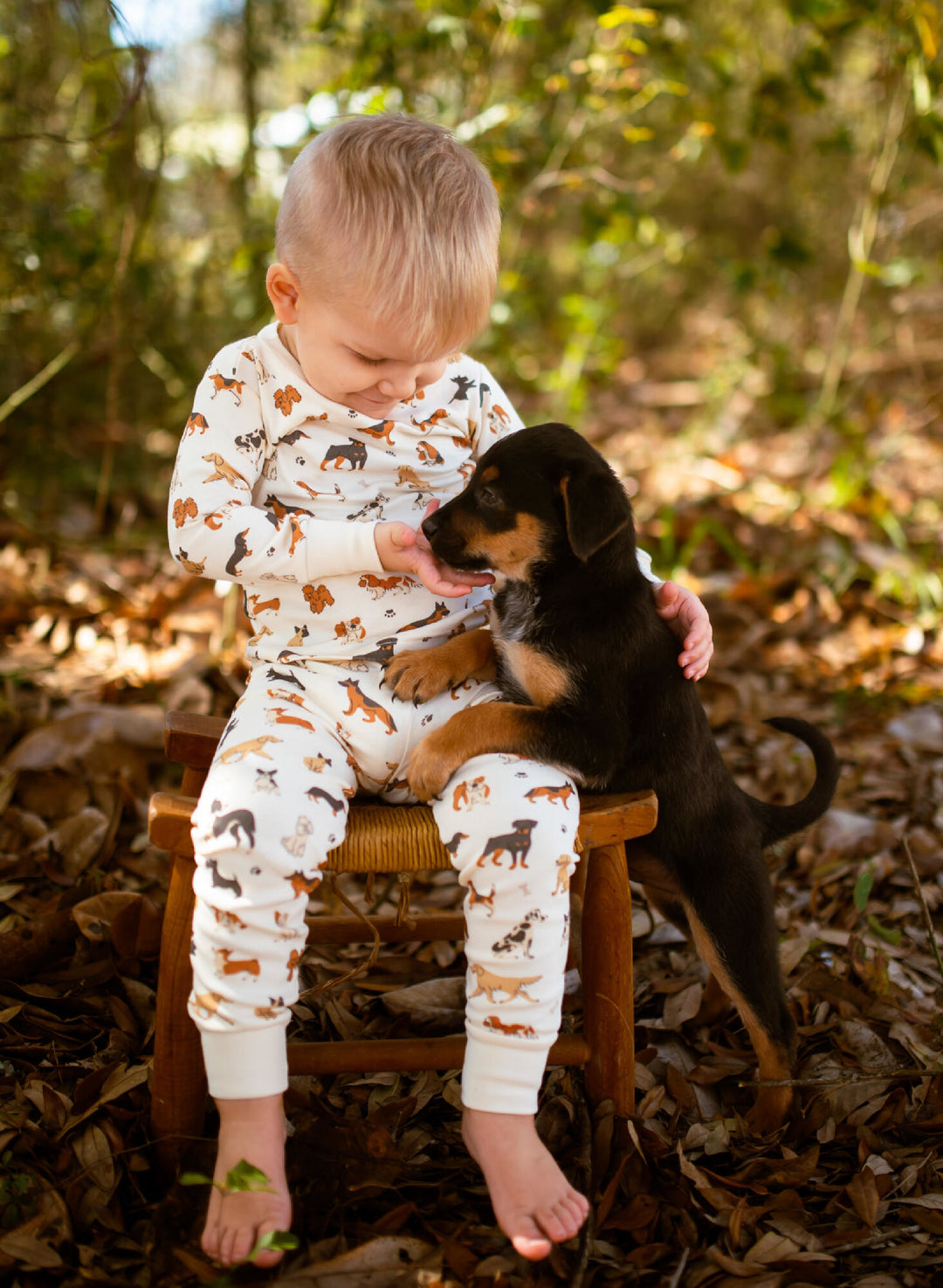 Child wearing Kids' Organic L/Sleeve PJ Set in Puppy Love.