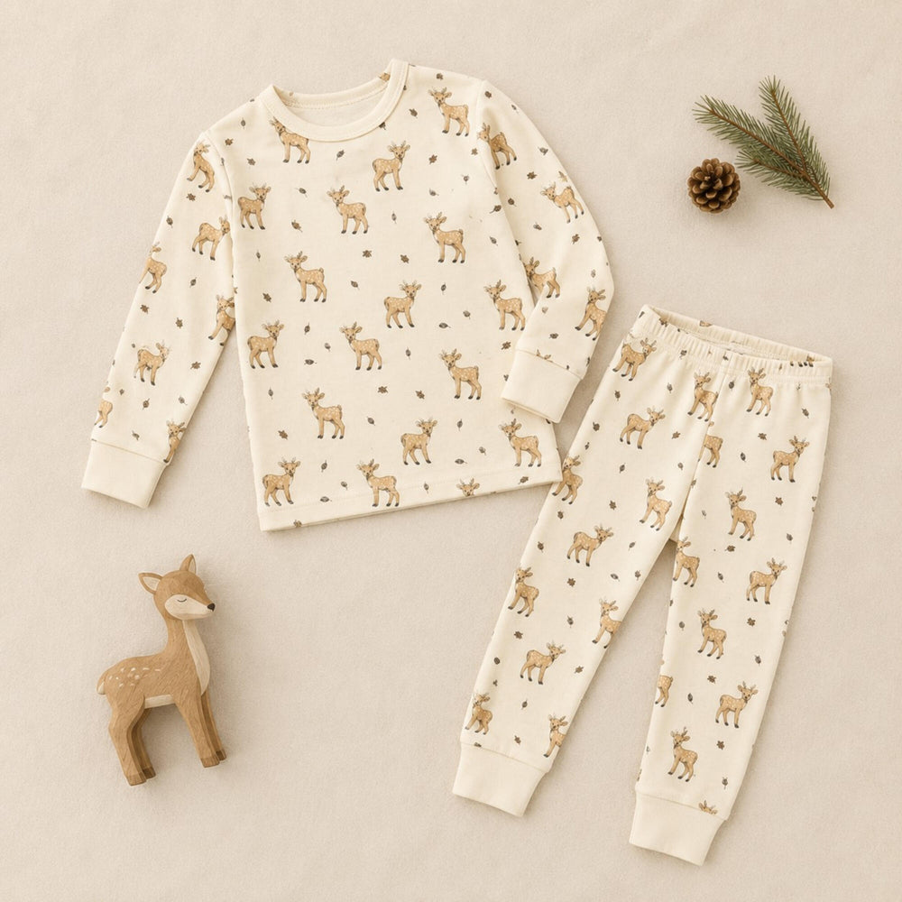 Child wearing Kids' Organic L/Sleeve PJ Set in White Tail Deer.