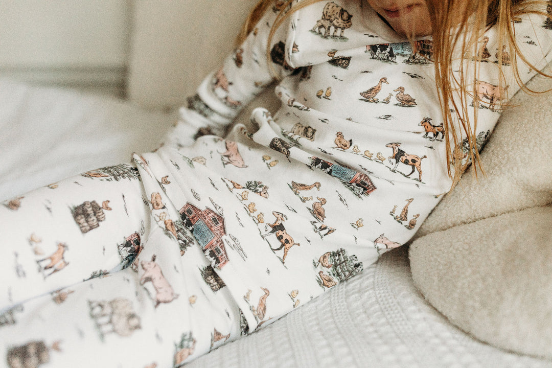 Child wearing Kids' Organic L/Sleeve PJ Set in Farm Friends.
