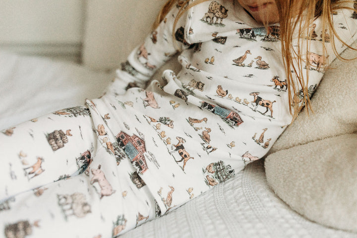 Child wearing Kids' Organic L/Sleeve PJ Set in Farm Friends.
