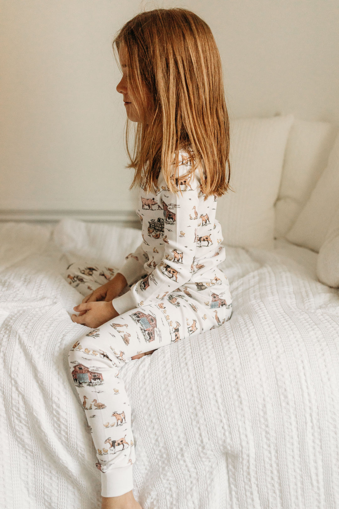 Child wearing Kids' Organic L/Sleeve PJ Set in Farm Friends.