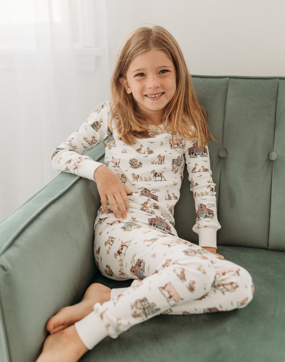 Child wearing Kids' Organic L/Sleeve PJ Set in Farm Friends.