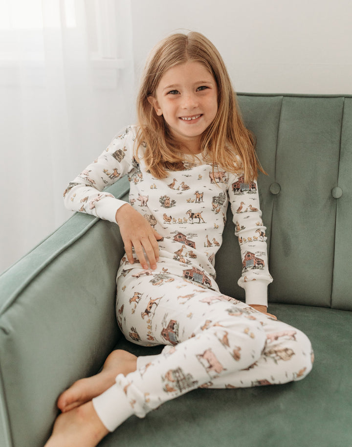 Child wearing Kids' Organic L/Sleeve PJ Set in Farm Friends.