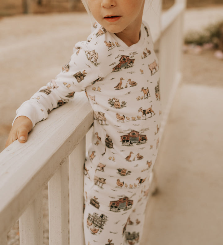 Child wearing Kids' Organic L/Sleeve PJ Set in Farm Friends.