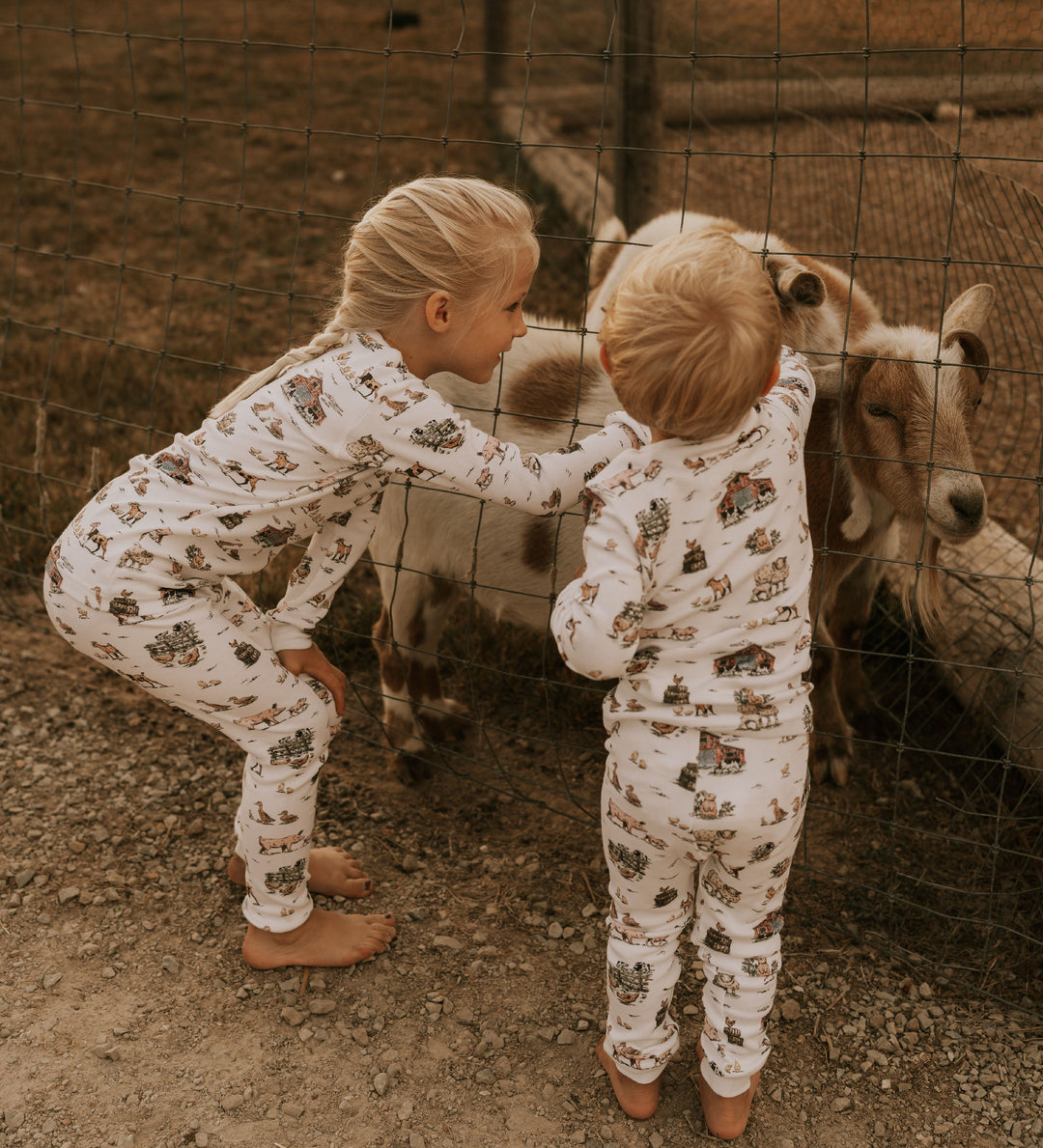 Child wearing Kids' Organic L/Sleeve PJ Set in Farm Friends.