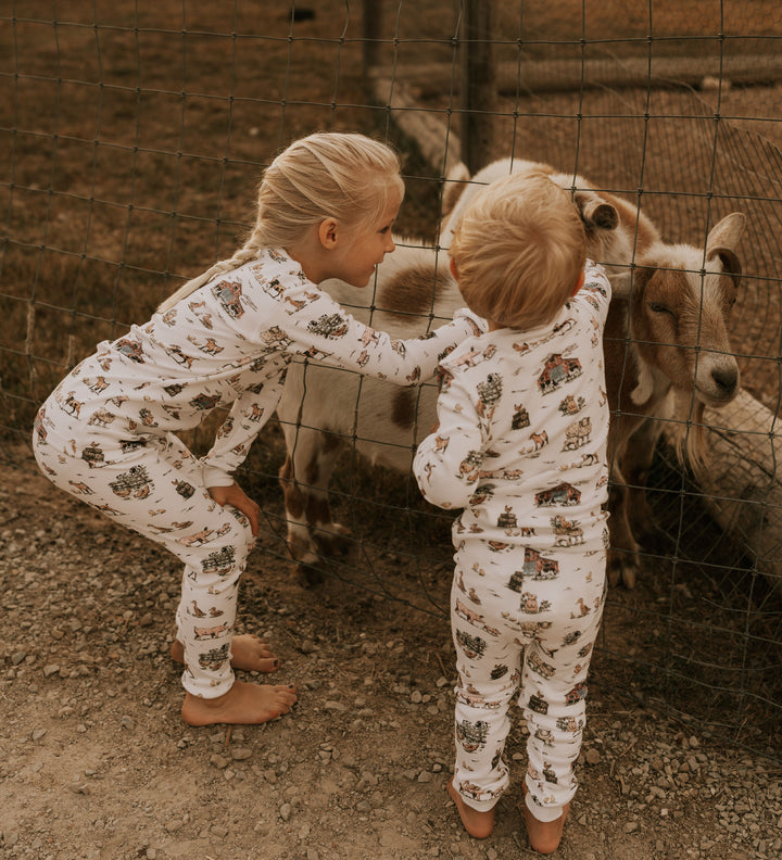 Child wearing Kids' Organic L/Sleeve PJ Set in Farm Friends.