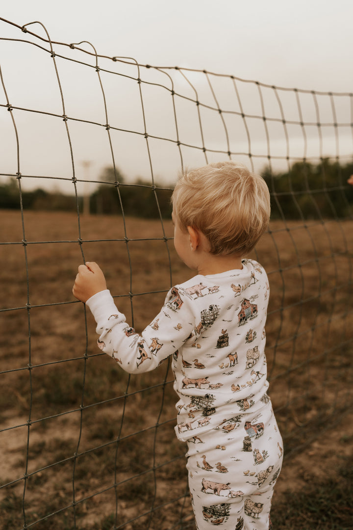 Child wearing Kids' Organic L/Sleeve PJ Set in Farm Friends.